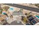 Aerial view of home with pool, landscaped yard, and proximity to roads and neighboring houses at 4542 W Villa Theresa Dr, Glendale, AZ 85308