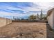 Large, empty backyard space ready for customization and landscaping with a block wall surround at 4542 W Villa Theresa Dr, Glendale, AZ 85308