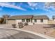 Charming single-story home with desert landscaping, neutral paint and a two-car garage at 4542 W Villa Theresa Dr, Glendale, AZ 85308