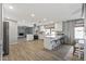 Open-concept kitchen with white cabinets, a large island, and modern appliances at 4542 W Villa Theresa Dr, Glendale, AZ 85308