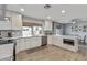 Modern kitchen with white cabinetry, stainless steel appliances, and sleek countertops at 4542 W Villa Theresa Dr, Glendale, AZ 85308