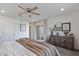 Spacious bedroom with ceiling fan, sliding door and neutral decor elements at 4542 W Villa Theresa Dr, Glendale, AZ 85308