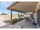 Covered patio area with string lights and furniture, perfect for outdoor entertaining at 4542 W Villa Theresa Dr, Glendale, AZ 85308