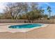 Swimming pool with a concrete surround, landscaping, and partial fencing at 4542 W Villa Theresa Dr, Glendale, AZ 85308