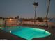 Inviting community pool with surrounding patio furniture at 455 S Delaware Dr # 154, Apache Junction, AZ 85120