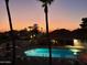 Community pool and spa area at sunset at 455 S Delaware Dr # 154, Apache Junction, AZ 85120