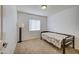 Small bedroom with twin bed, nightstand, and window with blinds at 5153 W Pontiac Dr, Glendale, AZ 85308