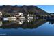 Waterfront homes with mountain backdrop and reflections at 5153 W Pontiac Dr, Glendale, AZ 85308