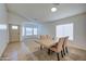 Formal dining room with light wood table and four chairs at 5153 W Pontiac Dr, Glendale, AZ 85308