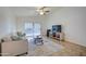 Living room with neutral colored couch and large windows at 5153 W Pontiac Dr, Glendale, AZ 85308