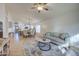 Open living room with adjacent kitchen and dining area at 5153 W Pontiac Dr, Glendale, AZ 85308