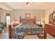 Bedroom featuring a wooden bed frame and ample natural light at 5251 W Posse Dr, Eloy, AZ 85131