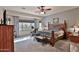 Bright bedroom with ceiling fan and wood furniture at 5251 W Posse Dr, Eloy, AZ 85131