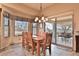 Bright dining area with wood table and patio access at 5251 W Posse Dr, Eloy, AZ 85131