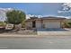 Single-story home with two-car garage and desert landscaping at 5251 W Posse Dr, Eloy, AZ 85131