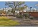 Landscaped front yard with gravel, cacti, and grass at 5251 W Posse Dr, Eloy, AZ 85131