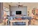 Living room with leather couches and a large TV at 5251 W Posse Dr, Eloy, AZ 85131