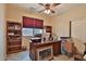 Home office with built-in shelving and wood desk at 5251 W Posse Dr, Eloy, AZ 85131