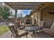 Patio seating area with firepit and pergola at 5251 W Posse Dr, Eloy, AZ 85131