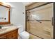 Bathroom with walk-in shower and wood vanity at 5331 W Mescal St, Glendale, AZ 85304