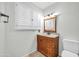 Bathroom with wood vanity, toilet and shutters at 5331 W Mescal St, Glendale, AZ 85304