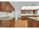 Kitchen with island, wood cabinets, and granite countertops at 5331 W Mescal St, Glendale, AZ 85304