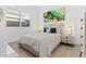 Bright bedroom with white walls and wood-look tile flooring at 5724 S Coyote Cyn, Mesa, AZ 85212