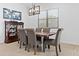 Formal dining room with wood table, upholstered chairs, and stylish light fixture at 5724 S Coyote Cyn, Mesa, AZ 85212