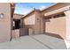 Inviting front entrance with a gated courtyard and attached garage at 5724 S Coyote Cyn, Mesa, AZ 85212