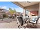 Inviting outdoor patio area with a cozy seating, dining, and barbecue areas for entertaining at 5724 S Coyote Cyn, Mesa, AZ 85212