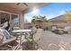 Relaxing outdoor patio area with ceiling fan for added comfort on warm sunny days at 5724 S Coyote Cyn, Mesa, AZ 85212