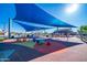 Community playground with shade canopies and colorful play equipment at 5724 S Coyote Cyn, Mesa, AZ 85212