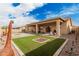 Large backyard with artificial turf and patio at 5836 S 58Th Gln, Laveen, AZ 85339