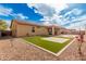 Artificial turf, gravel, and patio in sunny backyard at 5836 S 58Th Gln, Laveen, AZ 85339