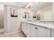 Double vanity bathroom with granite countertops and a walk-in shower at 5836 S 58Th Gln, Laveen, AZ 85339