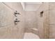 Large tiled shower with built-in seat and dual shower heads at 5836 S 58Th Gln, Laveen, AZ 85339