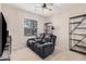 Relaxing sitting area with comfortable recliner and built-in shelving at 5836 S 58Th Gln, Laveen, AZ 85339