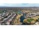 Wide aerial showcasing the community, golf course, and lake at 6282 W Rose Garden Ln, Glendale, AZ 85308