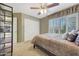 Bedroom with a double bed, built-in shelving, and window shutters at 6282 W Rose Garden Ln, Glendale, AZ 85308