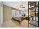 Bedroom with a double bed, window seat, and built-in shelving at 6282 W Rose Garden Ln, Glendale, AZ 85308