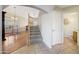 Entryway with staircase leading to the second floor and a view of the living room at 6282 W Rose Garden Ln, Glendale, AZ 85308