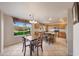 Kitchen features island, granite counters, and a view at 6282 W Rose Garden Ln, Glendale, AZ 85308