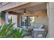 Covered patio with seating area and ceiling fan at 6282 W Rose Garden Ln, Glendale, AZ 85308