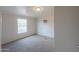 Bright bedroom with carpet flooring and a window at 645 S Warren Rd, Maricopa, AZ 85139