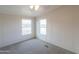 Bedroom with two windows and ceiling fan at 645 S Warren Rd, Maricopa, AZ 85139