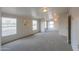 Large bedroom featuring two windows and ceiling fan at 645 S Warren Rd, Maricopa, AZ 85139