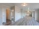 Open dining area with wood-look floors and kitchen views at 645 S Warren Rd, Maricopa, AZ 85139