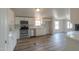 Kitchen with white cabinets and stainless steel appliances at 645 S Warren Rd, Maricopa, AZ 85139