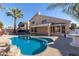 Relaxing backyard with a kidney-shaped pool at 6970 W Morning Dove Dr, Glendale, AZ 85308