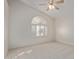 Bright bedroom with vaulted ceiling, ceiling fan, and large window with shutters at 6970 W Morning Dove Dr, Glendale, AZ 85308